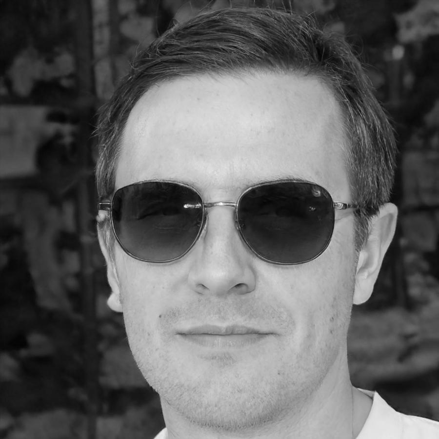 Senior financial analyst Marcus Chen reviewing quarterly reports